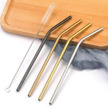 Charger l'image dans la galerie, Set of four stainless steel drinking straws in various colors with a cleaning brush on a wooden surface.