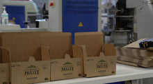 Charger l&#39;image dans la galerie, Packaging boxes for eco-friendly bagasse straws on a production table in a manufacturing facility.