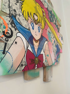 Pop art tableau of Sailor Moon on a wood palette, featuring vibrant colors and intricate details.