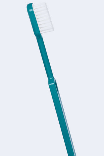 Brosse à dents française Caliquo bleue avec tête rechargeable en bioplastique, vue de côté, durable et écologique.