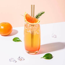 Charger l&#39;image dans la galerie, Cocktail with eco-friendly straw, garnished with citrus and rosemary, served over ice.